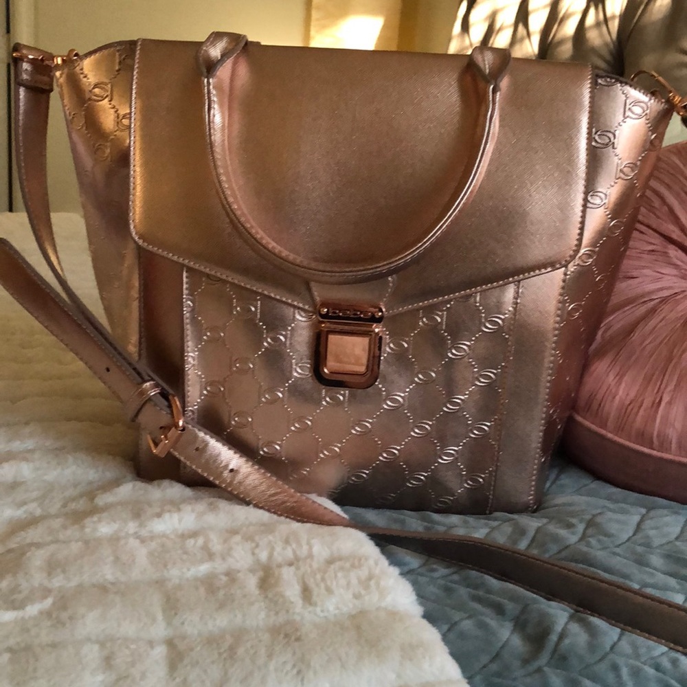 BeBe Metallic Rose Gold Handbag large size . NWOT, never used.